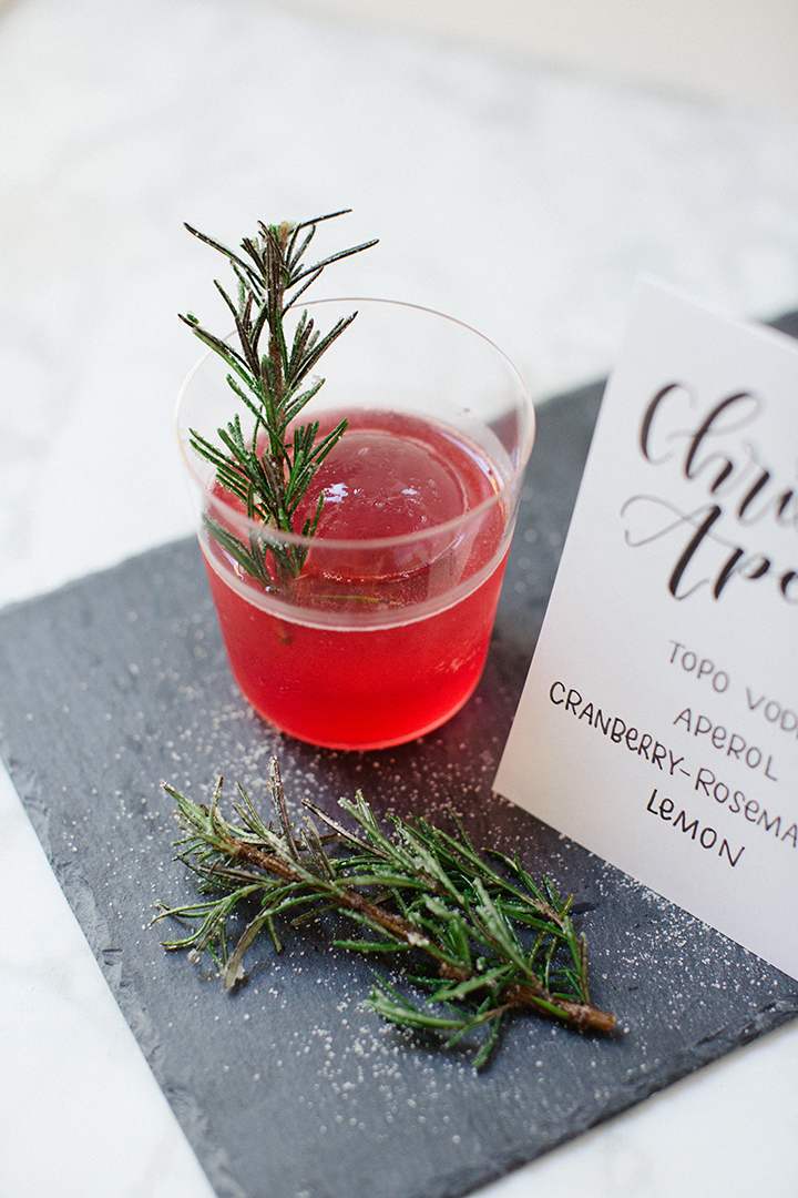 Four Unique Holiday Cocktail recipes for your next winter gathering by Reverie Cocktails and Amy Rae Co.  Winter Gin and Tonic, Bourbon Punch, Rye Manhattan, Vodka-sour Aperol.